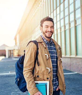 Buy stock photo Student, portrait and excited at campus for class, education and university experience with backpack. Man, face and happy outdoor at college for scholarship, learning and independence with books