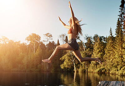 Buy stock photo Jump, woman and lake in nature for swim, fun and refresh in woods for travel adventure. Vacation, river or water for tourism outdoor for female person, happy and holiday in Germany forest in swimsuit