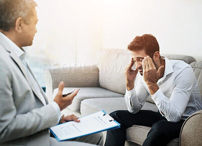 Buy stock photo PTSD, psychology or trauma with counsellor and patient in office of hospital for grief, loss or pain. Depression, stress and therapy with man talking to mental health doctor for counseling or rehab