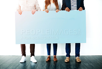 Buy stock photo Poster, mockup and hands of business people with banner news, announcement and hiring info on wall background. Recruitment, billboard and feet of employees with space for job, opportunity or promo