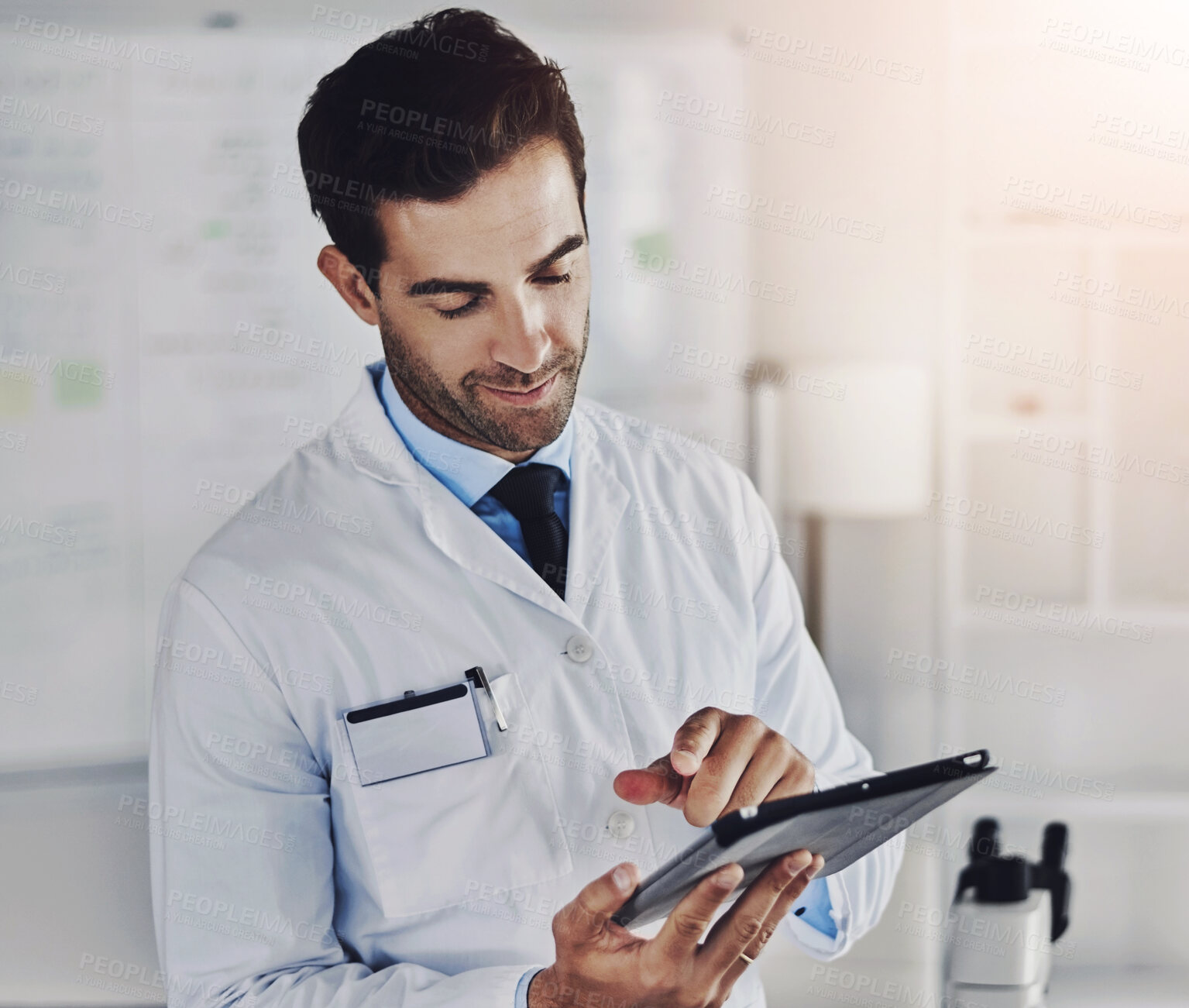 Buy stock photo Man, scientist and online with tablet in laboratory for medical research, planning and monitor experiment or observation. Male doctor, technology and internet for scientific calculations and analysis