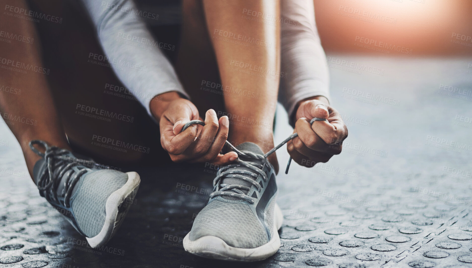 Buy stock photo Gym, hands and person tie shoes to start exercise, training or workout at health club closeup on floor. Legs, athlete and tying lace on sneakers to prepare or get ready for sport, fitness or wellness