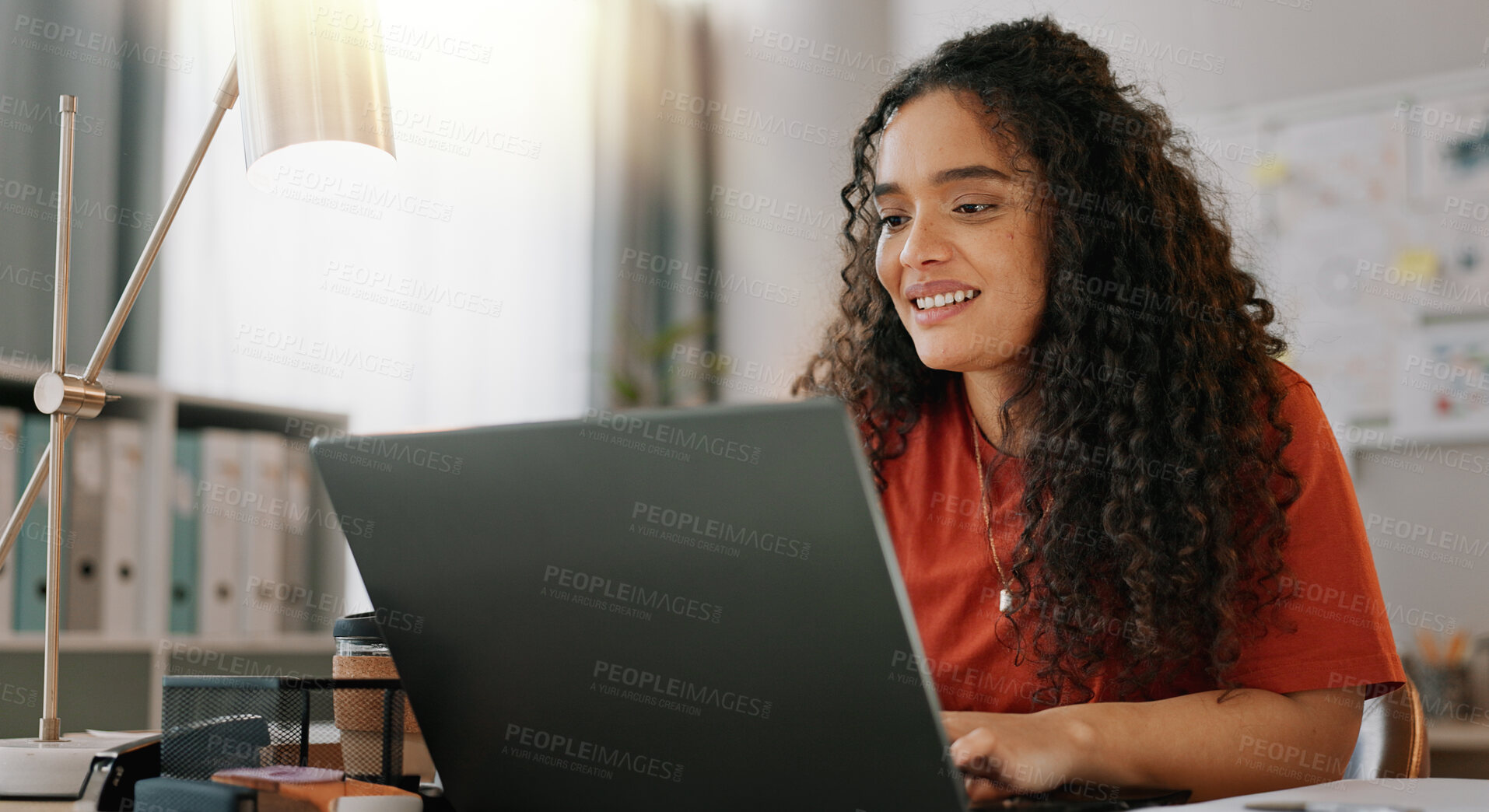 Buy stock photo Research, woman and smile at desk with laptop, communication and update in office. Female journalist, typing and happy at computer for article, social media and contact in modern workplace in city