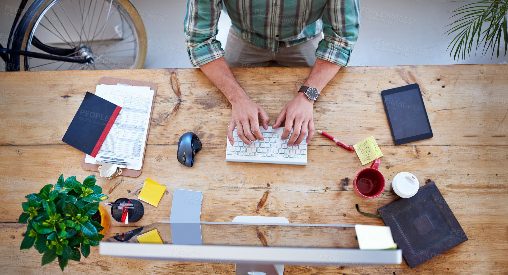 Buy stock photo Typing, creative person and hands from above for productivity, communication and review in modern office. Desk, wireless keyboard and computer on table for email, design and networking on internet