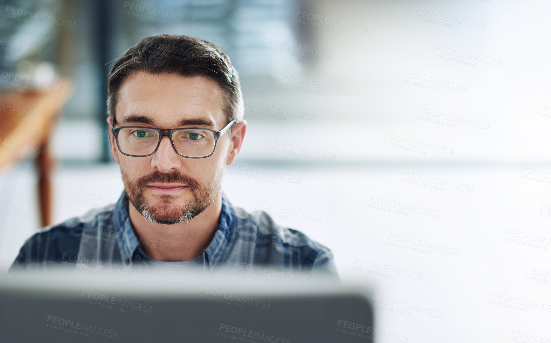 Buy stock photo Man, glasses and computer in office for review, typing and research in workplace. Businessman, startup and reading at desk for communication, thinking and networking or feedback with technology