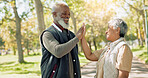 Senior couple, fitness and high five outdoor for wellness, health and well done with support, success or goals. Happy elderly people with hands together for exercise, cardio and training in nature