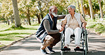 Senior, man and woman with disability in park for fresh air, walking and enjoyment of retirement or wellness with love. Couple, talk and outdoor in nature garden for bonding, together and happiness.