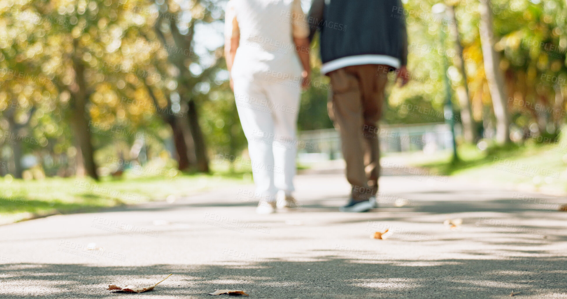 Buy stock photo Mature couple, retirement and back walking together outdoor for exercise, health and bonding in park. Senior people, nature and commitment for marriage, relationship and dedication in old age