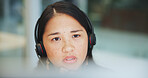 Thinking, call center and Asian woman in customer service for help, support or planning crm. Face, telemarketing and consultant problem solving for solution, idea or listening to contact for decision