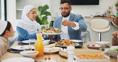 Buy stock photo Islamic, family and dinner at home for eid mubarak, muslim celebration and serve food on dining table. Ramadan, culture and religious gathering with conversation, eating and people bonding with lunch