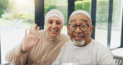 Buy stock photo Video call, home and senior muslim couple with communication, networking and connectivity. Happy, wave and elderly islamic man and woman in retirement on virtual discussion together at house.