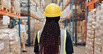 Woman, logistics and inspection of warehouse distribution safety, quality control and manufacturing development. Person back, engineer and helmet at plant site, inventory freight and cargo process