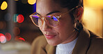 Business woman, planning and reading online at night for research with computer reflection in glasses. Young writer, lifestyle journalist or creative worker in bokeh for web copywriting or article