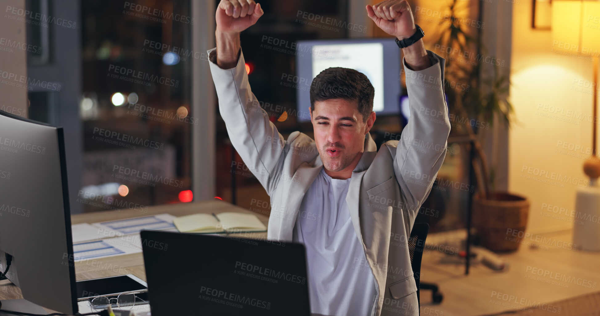 Buy stock photo Businessman, laptop and night with celebration for winning, promotion or done at office. Excited man or employee working late with fist pump for success, achievement or accomplishment at workplace