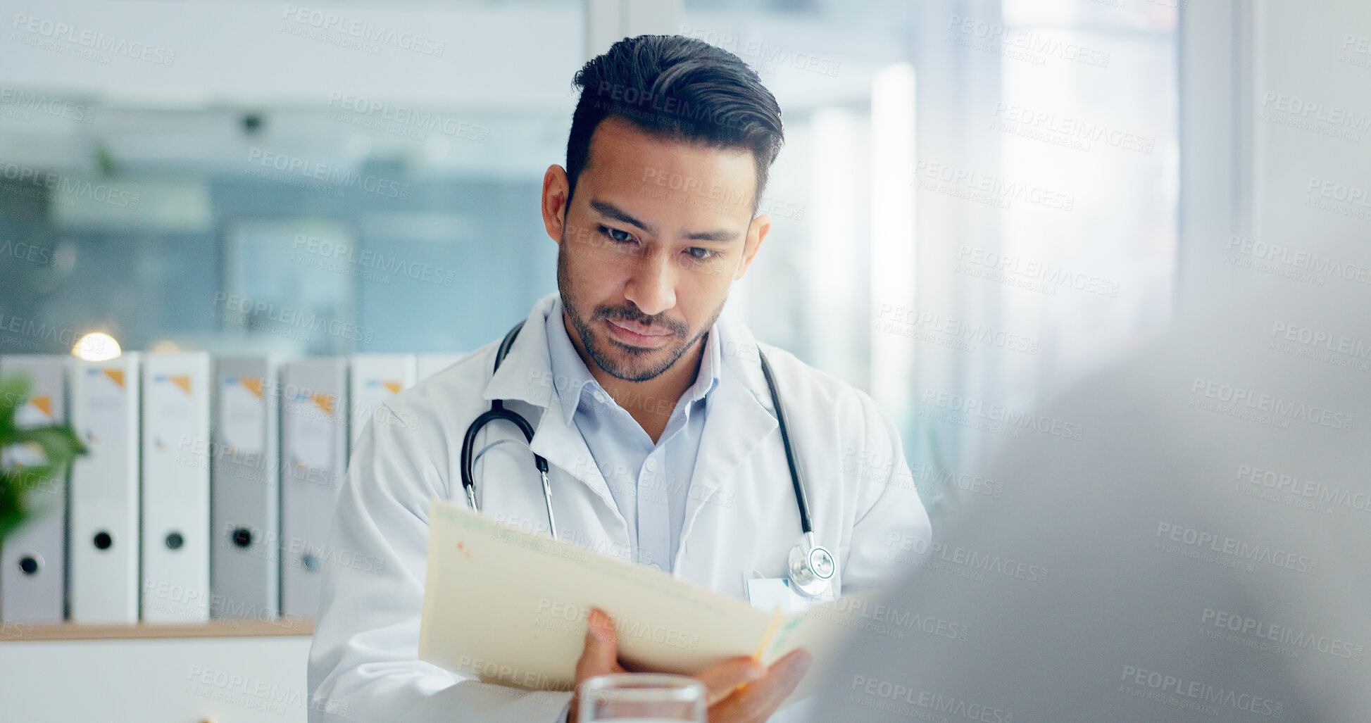 Buy stock photo Man, doctor and documents with patient for medical results, insurance or consultation at hospital. Male person or healthcare employee reading paperwork for prescription, diagnosis or clinic research