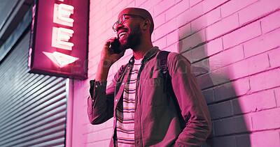 Buy stock photo Happy man, conversation and neon light with phone at night for communication outside bar, pub or club. Male person talking with smile in happiness on mobile smartphone for friendly discussion in city