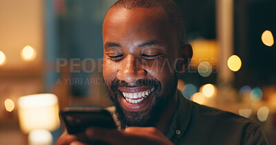 Buy stock photo Face, laughing and phone with black man in home at night for communication, meme or networking. Comedy, funny and humor with person reading text message on mobile in apartment for social media