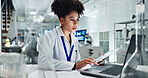 Woman, scientist and research with laptop and tablet for results, medical study or exam on new discovery at lab. Female person or biologist working on technology for experiment or test at laboratory