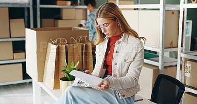 Woman, paperwork and package for shipping in office, planning and ecommerce order for inventory. Female person, clipboard and supply chain for delivery logistics, product and checklist for boxes