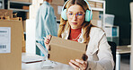 Industry, headphones and woman with package, box and parcel with ecommerce, delivery and entrepreneur. Business, sound and worker with cardboard, logistics order and listening to music with headset