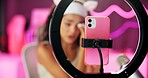 Woman, makeup and ring light for streaming, cellphone and beauty for influencer in home. Tutorial, talking and content creator person for followers on social media, cosmetics and vlog for recording