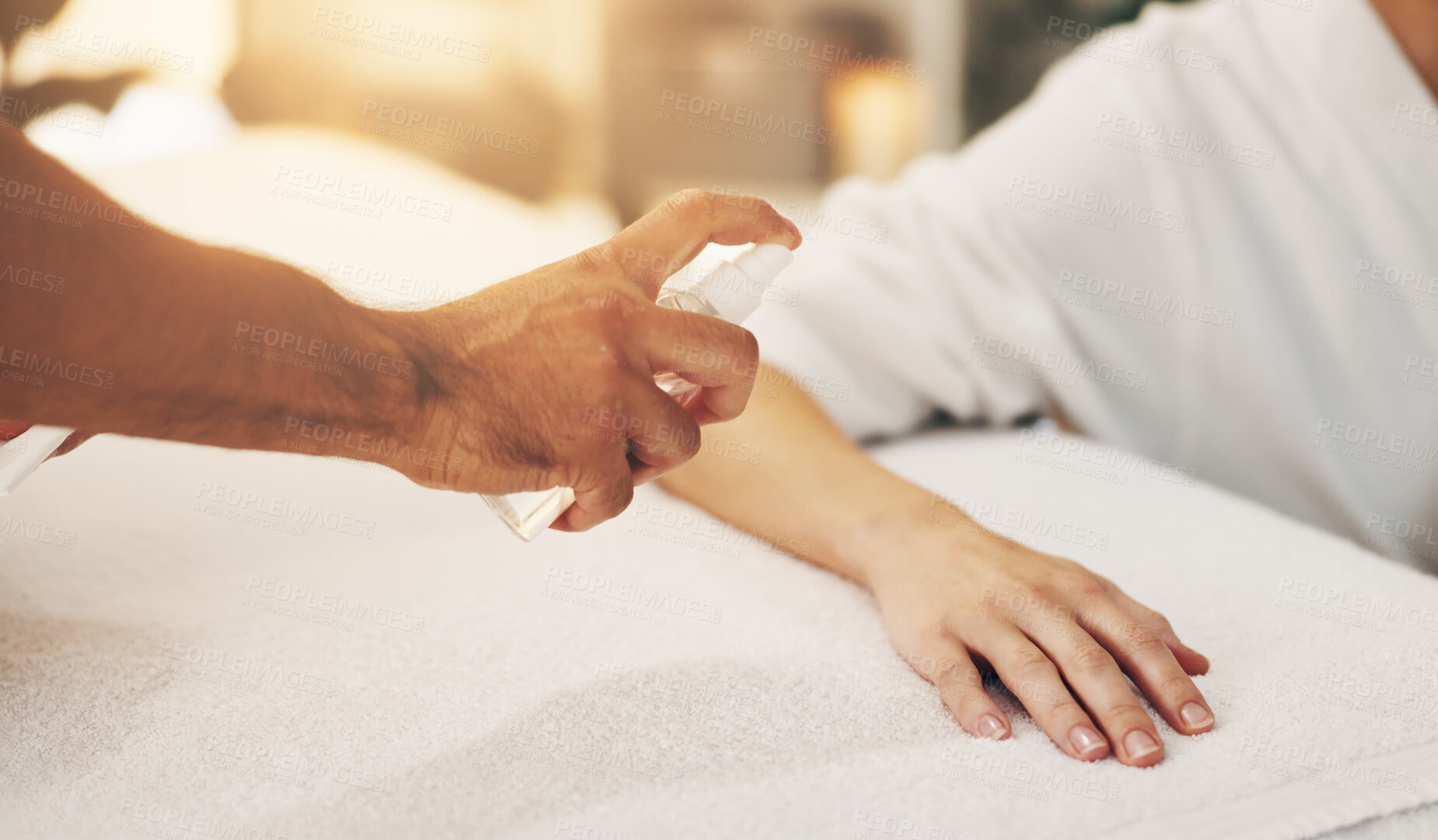 Buy stock photo Hands, oil and person in spa with stress or anxiety for massage, calm and holistic therapy. Client, spray and asian medicine with aromatherapy or alcohol for acupuncture, wellness and healthcare