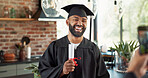 Graduation, man and happy with photo in home with certificate, diploma and success in education. Student, picture and laughing for social media post, memory and celebration for study achievement