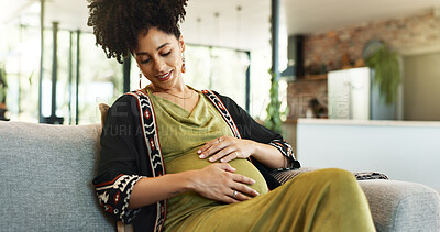 Buy stock photo Pregnant, love and woman on a sofa with hands on stomach for comfort, touch and resting in her home. Pregnancy, care and calm girl person relax in living room with peace, belly and healthy maternity