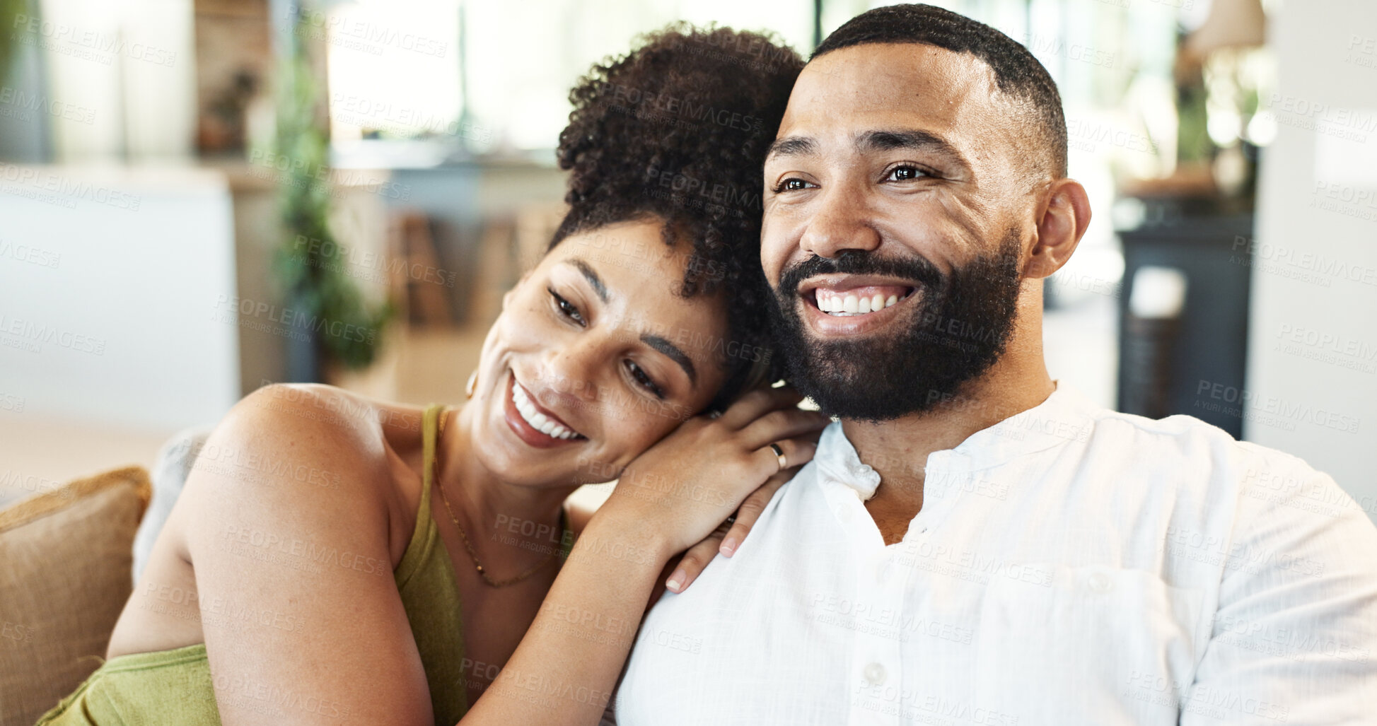 Buy stock photo Love, happy and couple on sofa relax for bonding, loving relationship and watching tv on weekend. Marriage, home and man and woman embrace on couch for affection, romance and smile in living room