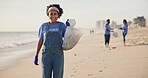 Beach, volunteer or happy woman with plastic bag for sustainability, help or ocean cleaning project. Accountability, portrait and volunteer at sea for earth day, social responsibility or NGO charity