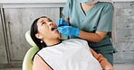 Woman, dentist and patient with clinic tools for cleaning mouth, oral or gum in dental care. Face of Asian or female person in relax with orthodontist for tooth whitening, hygiene or removing cavity