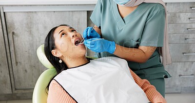 Buy stock photo Woman, dentist and patient with clinic tools for cleaning mouth, oral or gum in dental care. Face of Asian or female person in relax with orthodontist for tooth whitening, hygiene or removing cavity