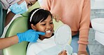 Child, pediatric dentist or checkup of teeth in surgery or family friendly examination of tooth. Girl, parent and support in orthodontist chair for trust and gentle with mirror for kids dental care