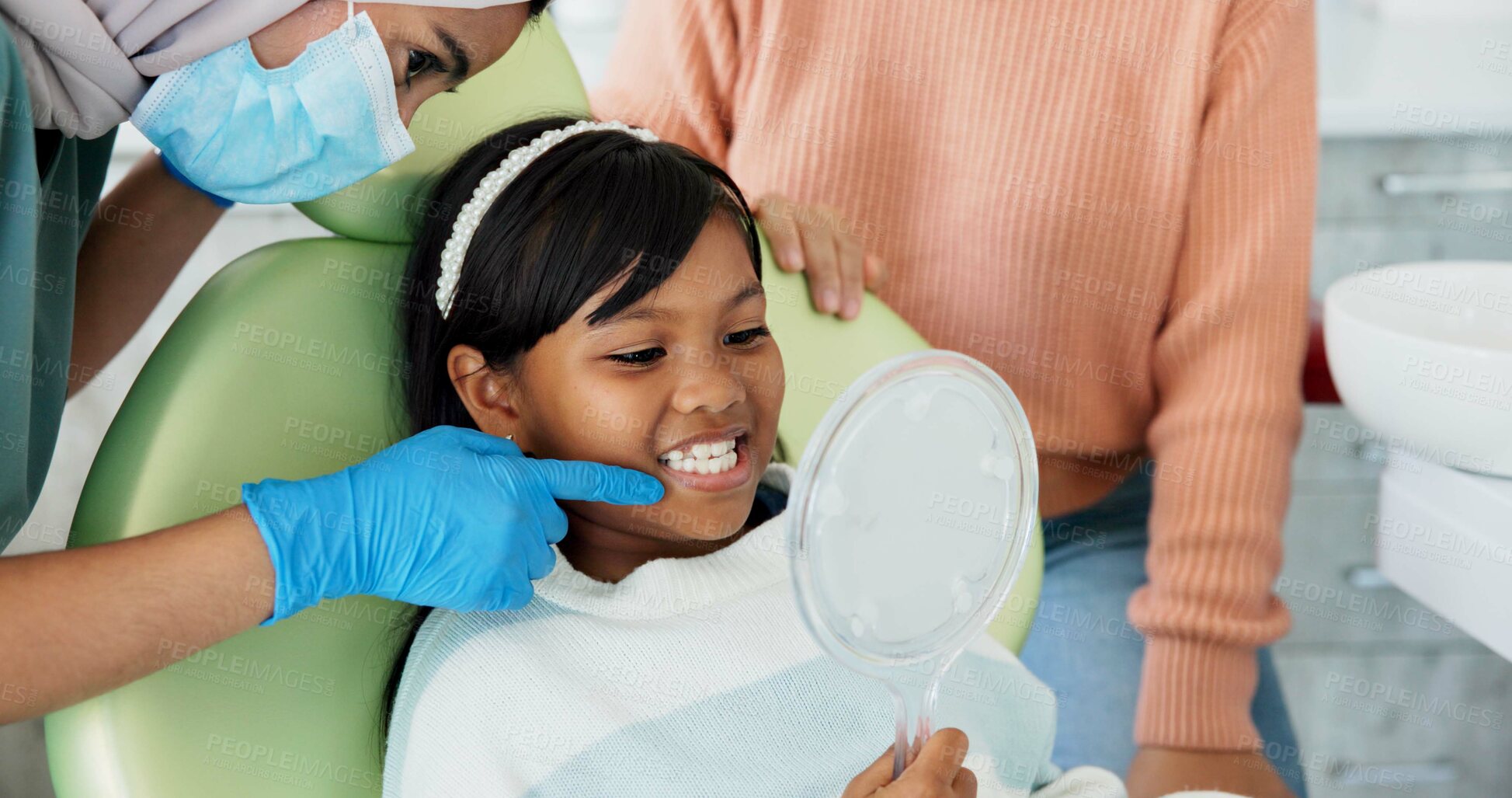 Buy stock photo Child, pediatric dentist or checkup of teeth in surgery or family friendly examination of tooth. Girl, parent and support in orthodontist chair for trust and gentle with mirror for kids dental care