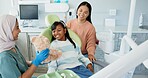 Dentist, children and girl hugging teddy bear for comfort or oral hygiene at appointment and checkup. Family, healthcare or dental care with mother and daughter at orthodontist for teeth consulting