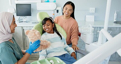 Buy stock photo Dentist, children and girl hugging teddy bear for comfort or oral hygiene at appointment and checkup. Family, healthcare or dental care with mother and daughter at orthodontist for teeth consulting