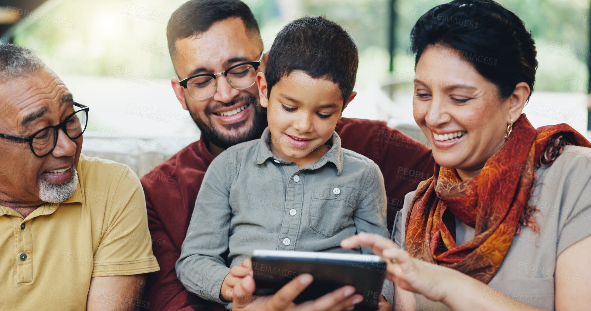 Buy stock photo Happy family, kid and tablet on sofa for games, fun or bonding with grandparents in living room. Father, senior people or child on digital technology for video, education or elearning support at home