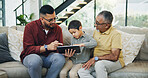 Tablet, sofa and child with dad and grandfather choose movie, video or film together. Happy, bonding and boy kid watching film on digital technology with father and senior man in living room at home.