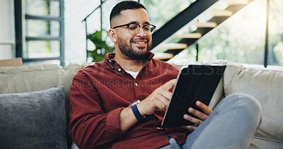 Buy stock photo Reading, glasses and happy man relax with tablet on sofa for social media, streaming and newsletter info at home. Digital, ebook and male person with app for subscription, research or service sign up