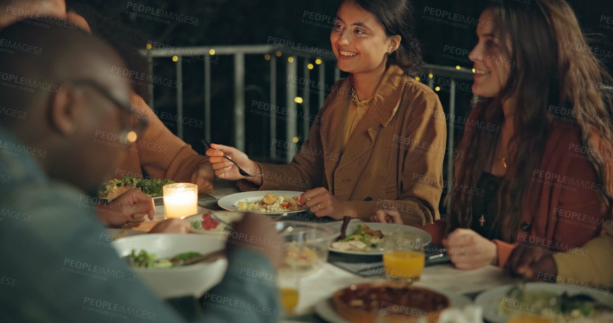 Buy stock photo Friends, happy and dinner in night, patio and talk for conversation, food and new years eve celebration. Women, man and group at table with chat, memory and comic laugh for joke, diversity and event