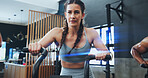 Fitness, bike machine and woman in gym for training, workout and cardiovascular endurance. Health club, people and female athlete on bicycle equipment for exercise, calorie burning or muscle strength