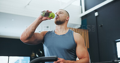 Buy stock photo Workout, man and drinking water in gym for hydration, thirsty and exercise break of bike machine. Training center, male cyclist and H2O bottle for wellness, healthy diet and fitness on bicycle