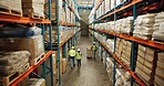 Warehouse, shipping and delivery people walking in a distribution, freight and supply chain company. Worker, contractor and stock at factory and export business with employee working with storage