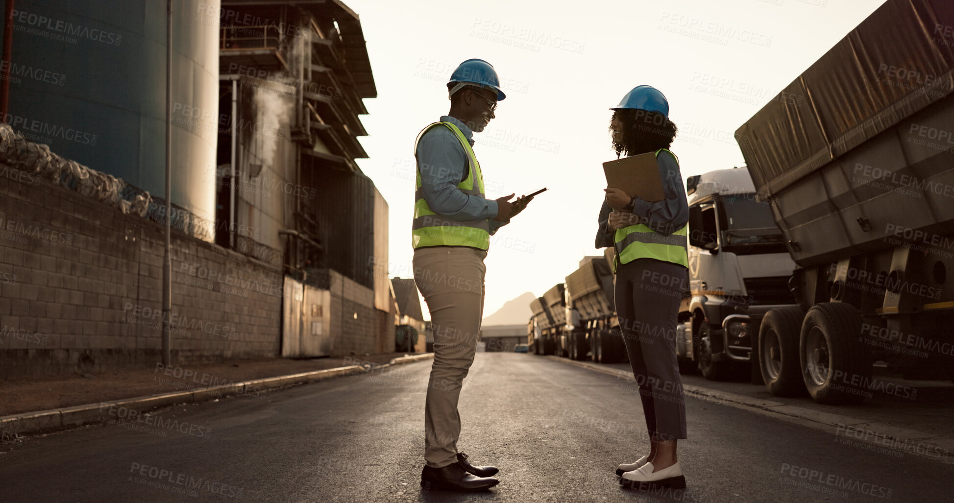 Buy stock photo Construction site, city and people in discussion for planning, building inspection and maintenance. Civil engineering, architecture team and man and woman for project, infrastructure or collaboration