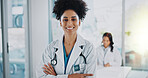 Woman, doctor and arms crossed in portrait at hospital for medicine development, consultation and support. Clinic, medical and happy with career, job growth and opportunity for healthcare project