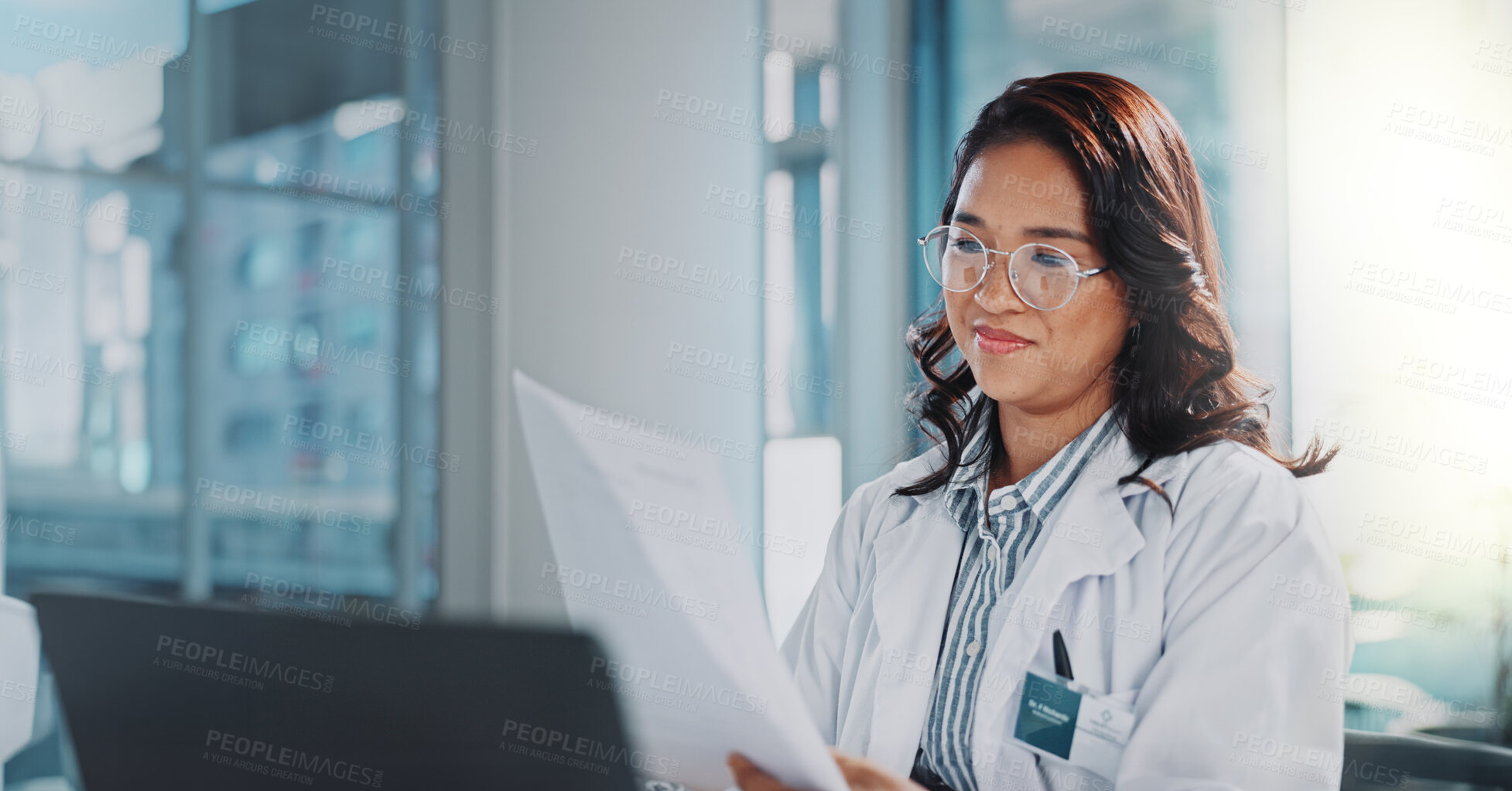 Buy stock photo Woman, doctor and smile with paperwork or laptop for research or study results and feedback. healthcare, medical and happy or satisfied with document for medicine or patient information in office