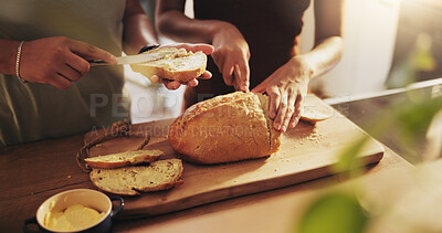 Buy stock photo Kitchen, butter and hands of people with bread on counter with slice for sandwich, breakfast and meal. Food, baking and baked goods, roll and loaf for wellness, eating and carbohydrates in home