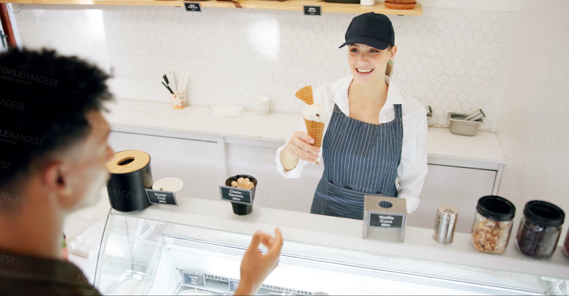 Buy stock photo Woman, ice cream and customer with service, gelato and smile with giving dessert at restaurant. Helping, server and waitress with working in for vanilla, cone and snack at counter with staff