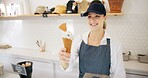 Woman, ice cream and customer service with food, gelato and smile with giving dessert at restaurant. Helping, server and waitress with working in for vanilla, cone and snack at counter with staff