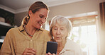 Senior, mother and woman with phone in home with helping for social media, online games and bingo app. Family, elderly person and discussion with smartphone for explaining, learning or happy in house